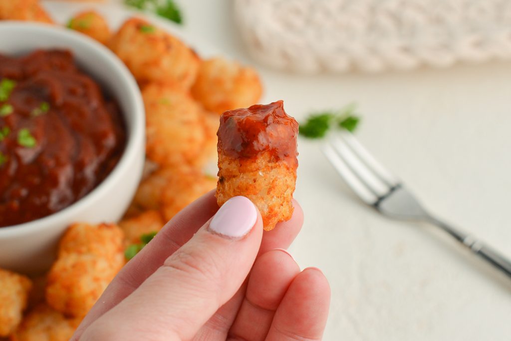 tater tot with chipotle ketchup on it