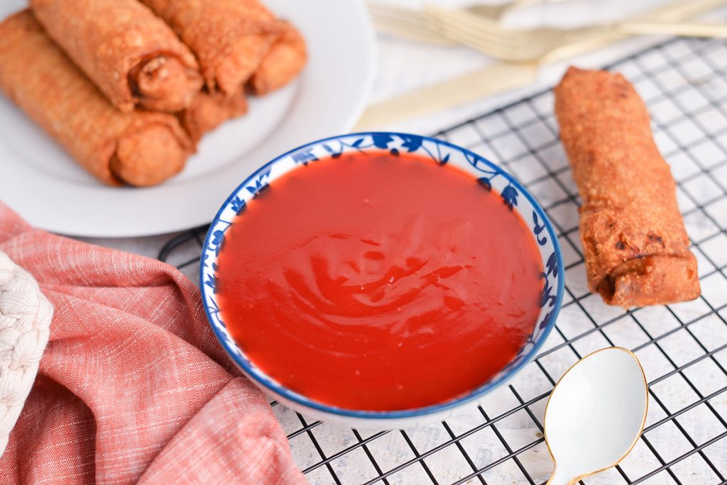 angled shot of sweet and sour sauce in a bowl