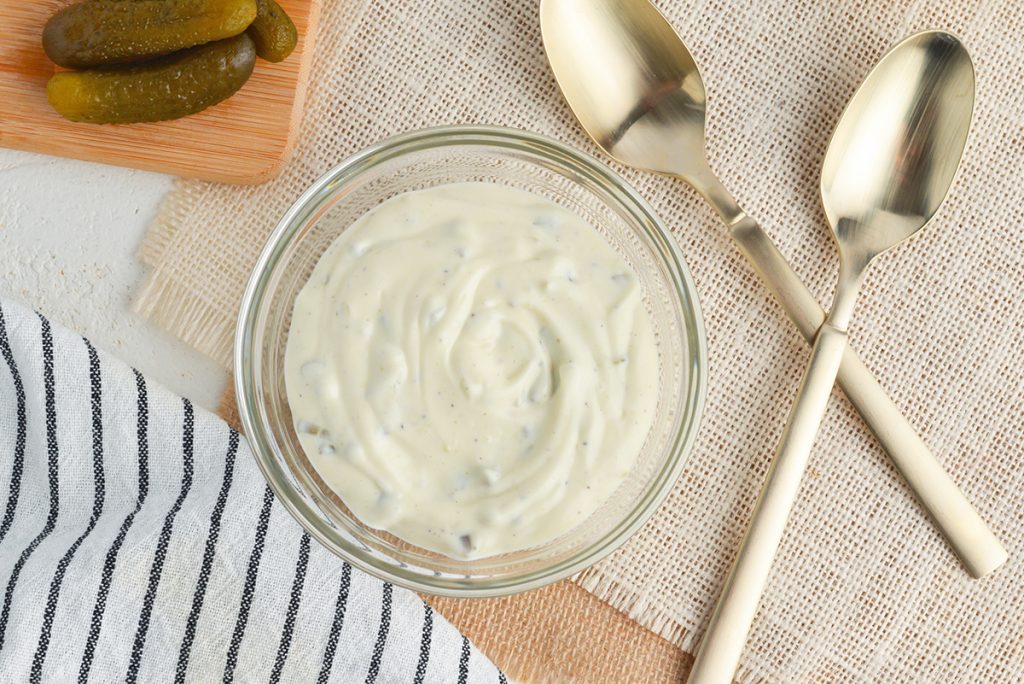bowl of tartar sauce with two spoons