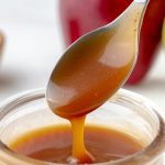 salted caramel sauce dripping off of spoon
