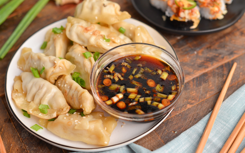 bowl of ginger sauce with dumplings