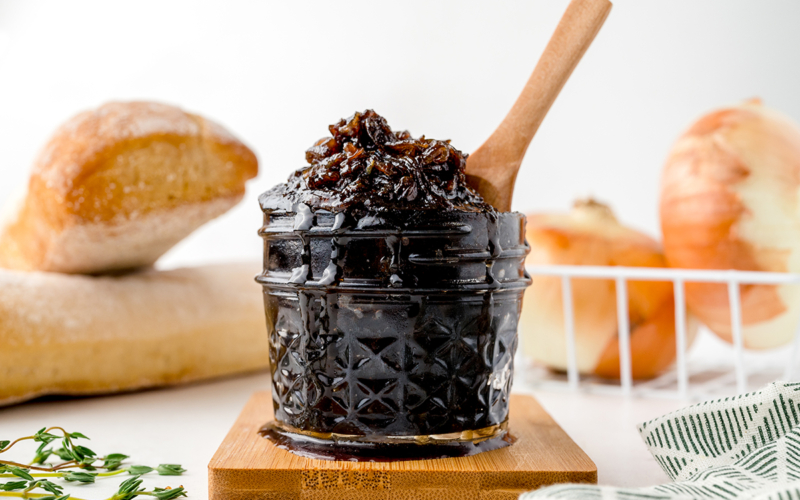 spoon in jar of caramelized onion jam