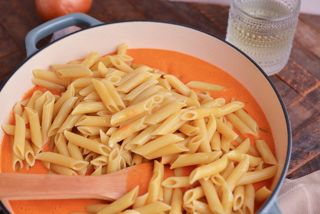 pasta in pan with pink sauce
