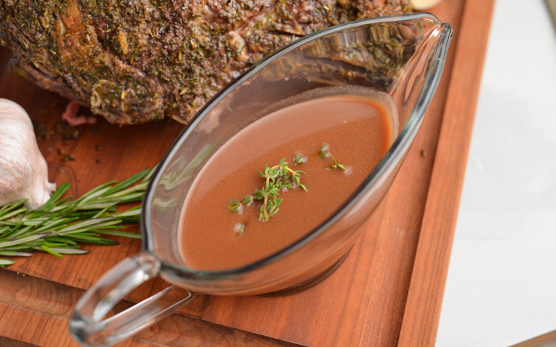 au jus sauce on a cutting board