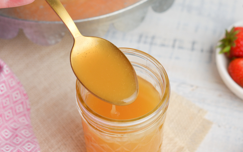 spoon in jar of bourbon sauce