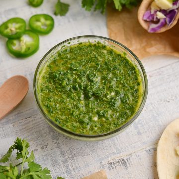 angled shot of cilantro sauce in a bowl