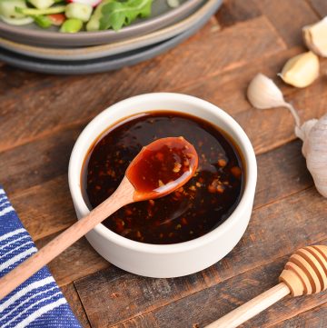 honey garlic sauce on a spoon