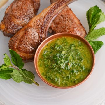 bowl of mint sauce with lamb chops