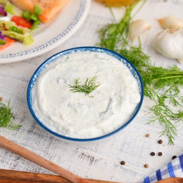 angled shot of bowl of dill sauce