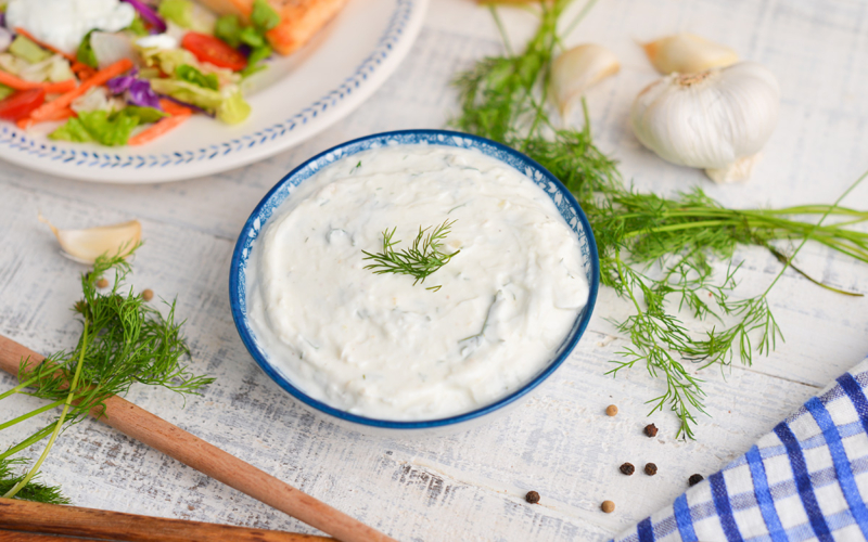 angled shot of bowl of dill sauce