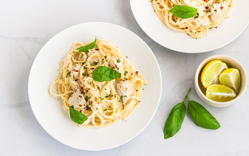 overhead bowl of alfredo sauce in bowls