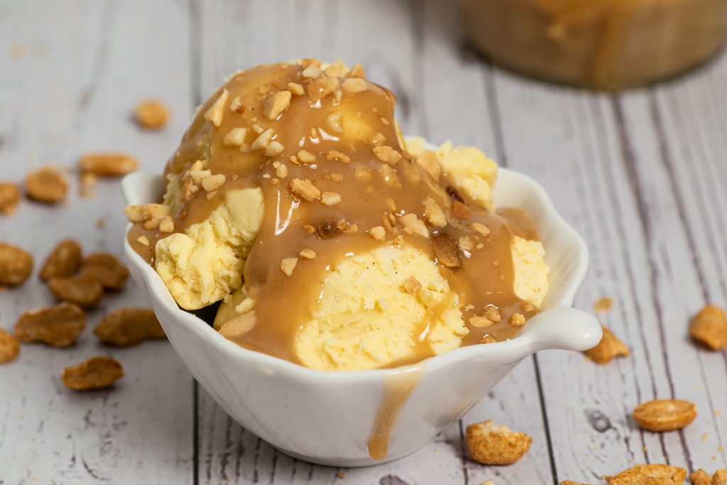 close up of peanut butter sauce on ice cream