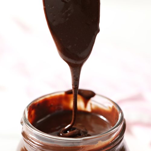spoon with chocolate sauce dripping off