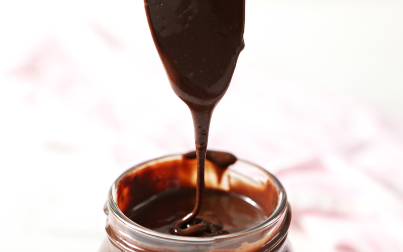 spoon with chocolate sauce dripping off