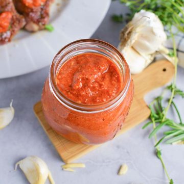 angled shot of romesco sauce in jar