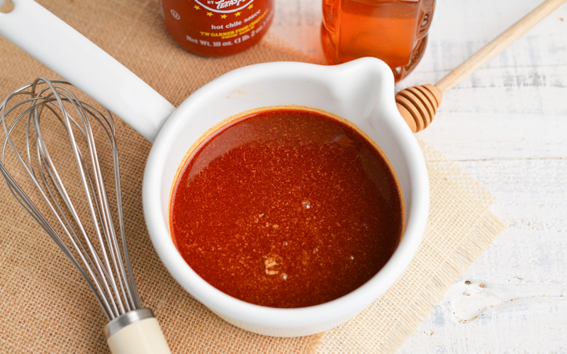 angled shot of honey sriracha sauce