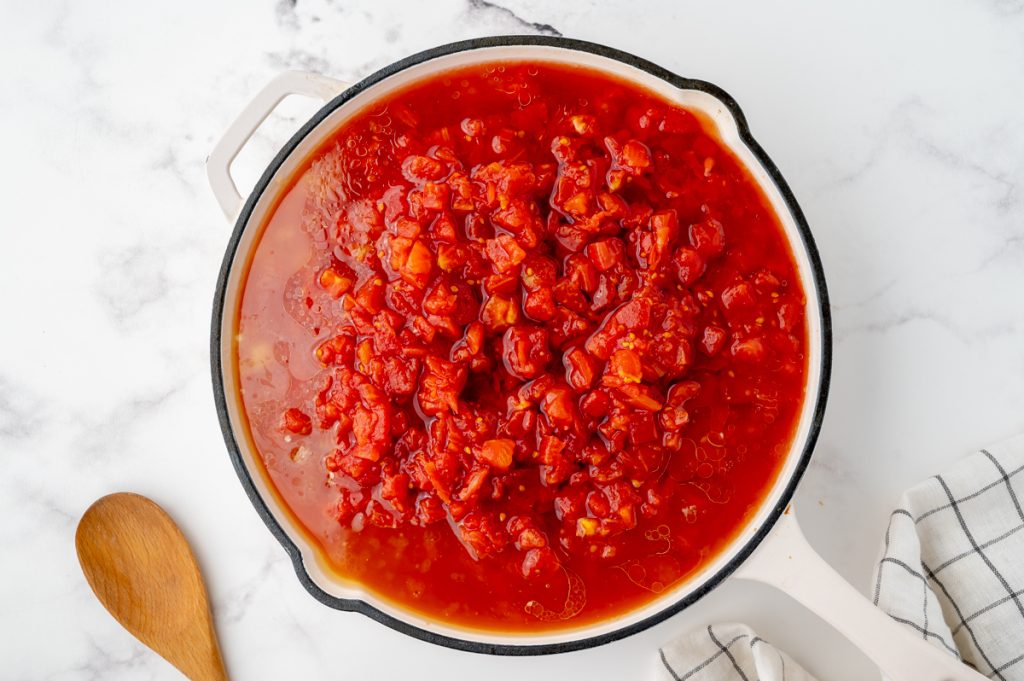 crushed tomatoes cooking in a pan