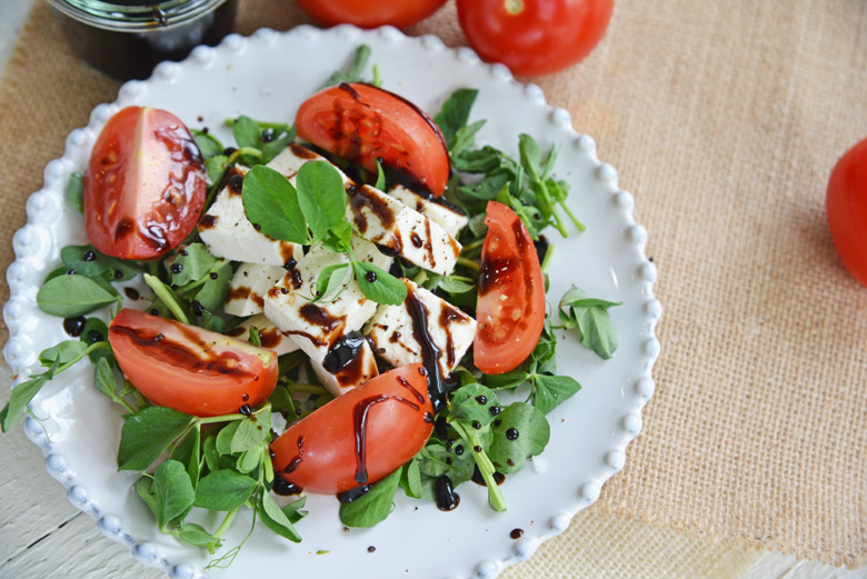 salad drizzled with balsamic glaze