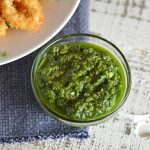 bowl of green dipping sauce with calamari