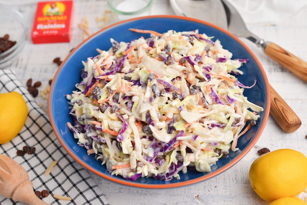 angled shot of creamy coleslaw in a bowl