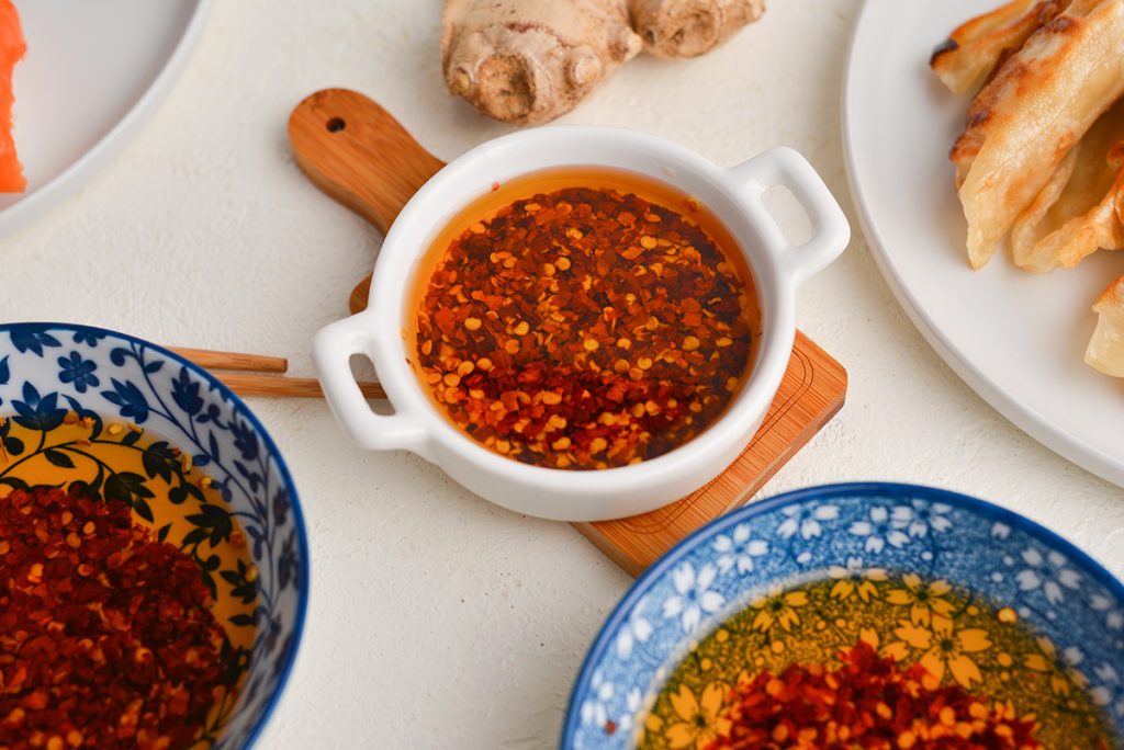 angled shot of chinese chili oil in white bowl