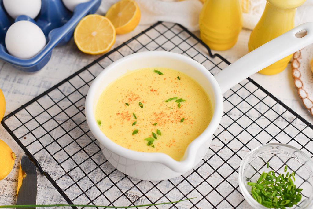 angled shot of hollandaise sauce in a bowl