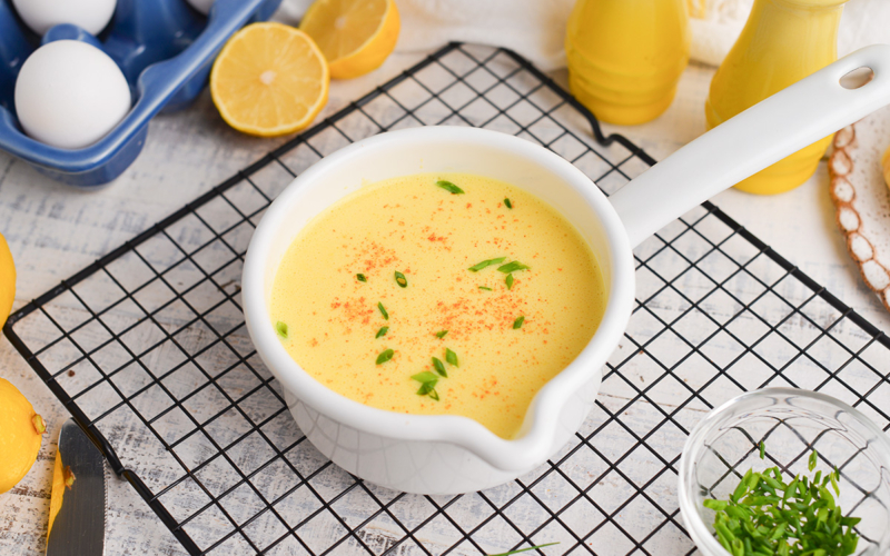 angled shot of hollandaise sauce in a bowl