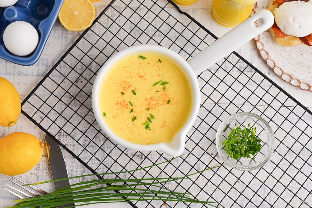 overhead shot of hollandaise sauce in a bowl