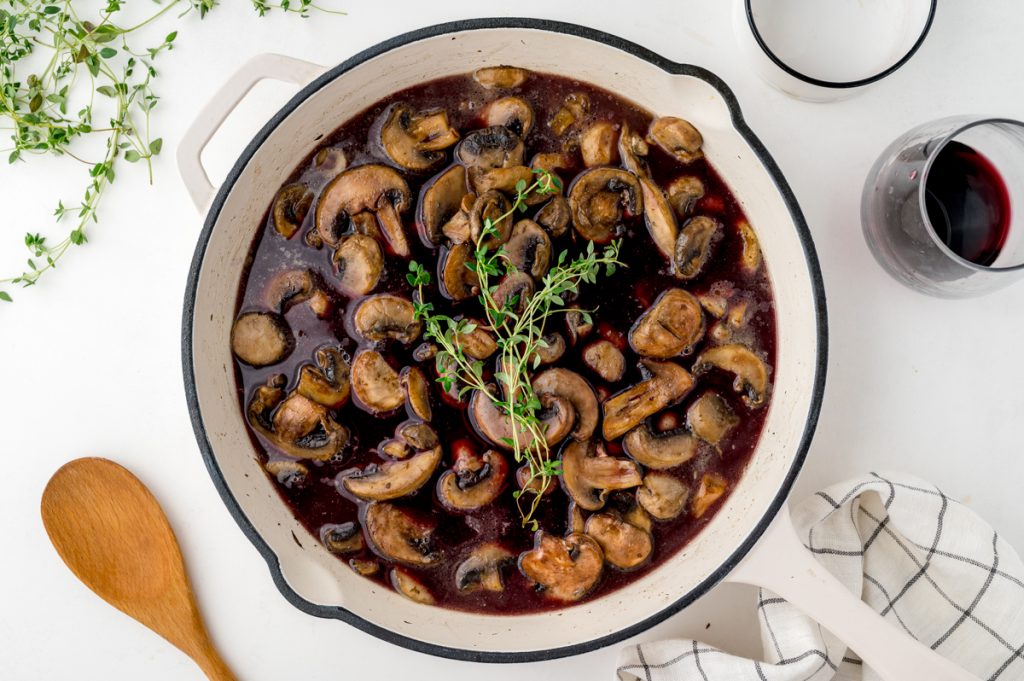red wine mushroom sauce cooking in pan