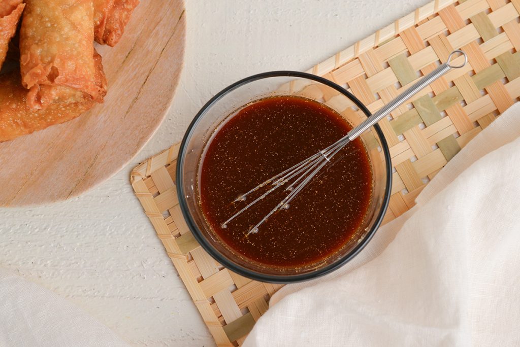 whisk in bowl of egg roll dipping sauce