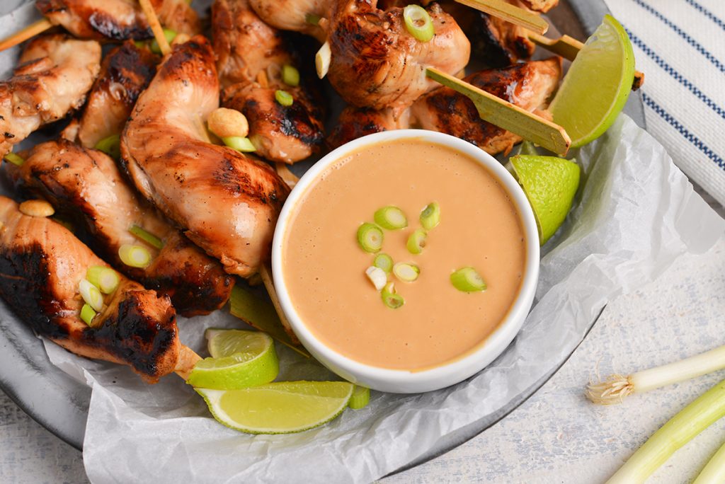 bowl of spicy peanut sauce with chicken