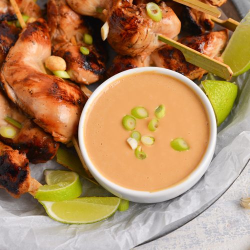 bowl of spicy peanut sauce with chicken