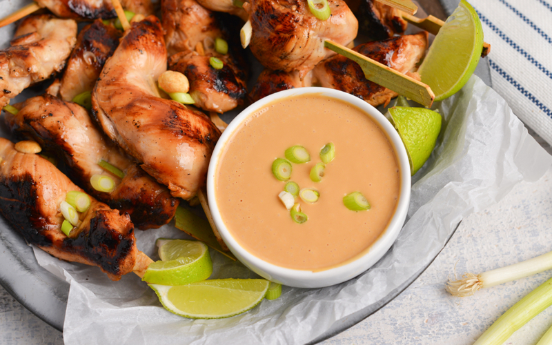 bowl of spicy peanut sauce with chicken