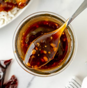 overhead shot of spoon full of szechuan sauce