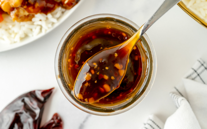 overhead shot of spoon full of szechuan sauce