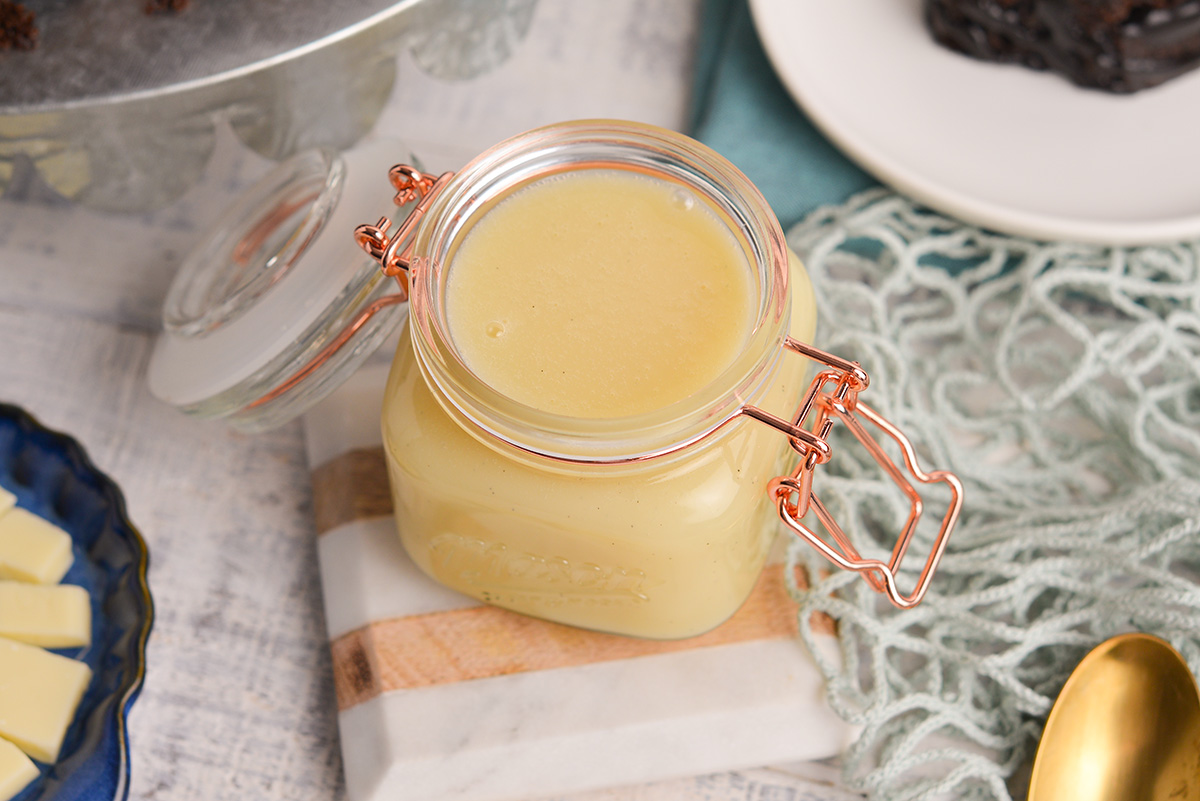 close up angled shot of jar of white chocolate sauce