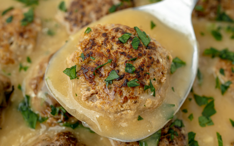 angled shot of swedish meatball on spatula