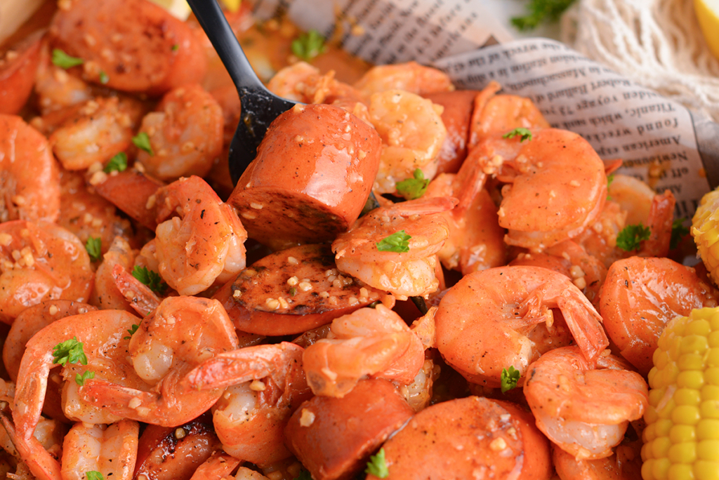 close up angled shot of shrimp boil with crab sauce recipe 