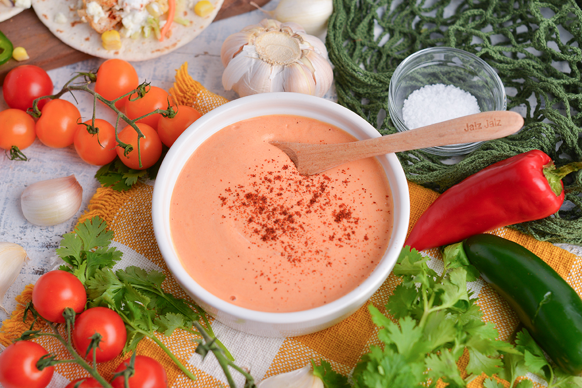 angled shot of bowl of chipotle sauce with spoon in it