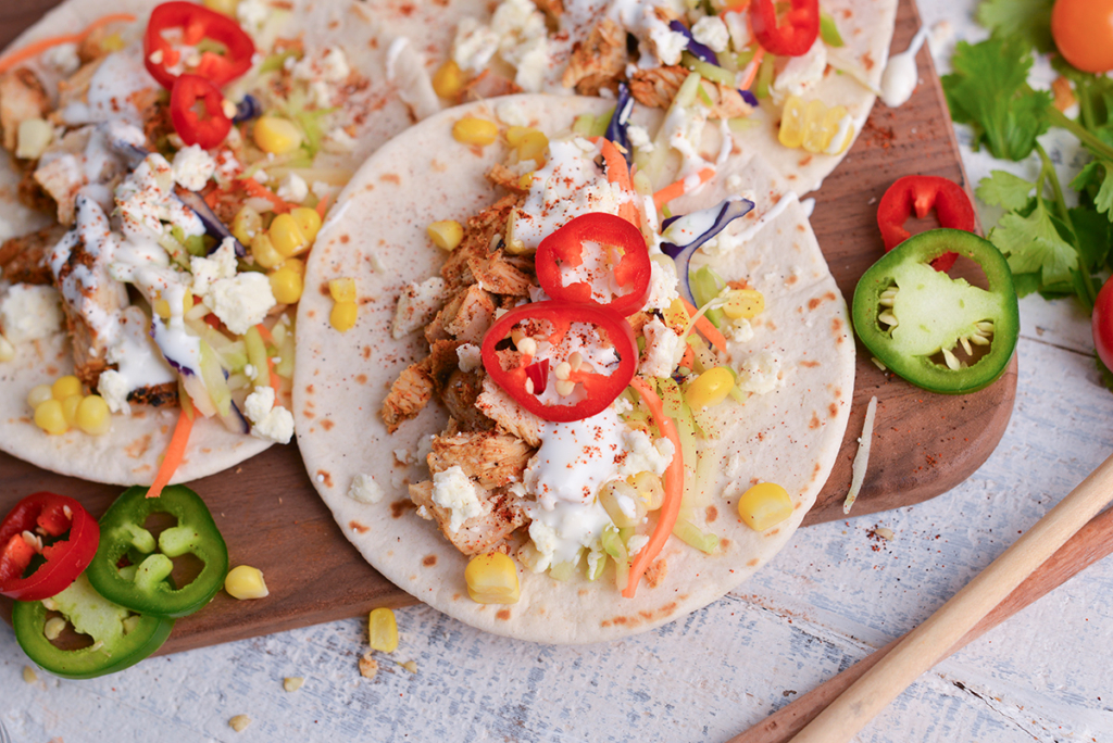 overhead shot of tacos topped with mexican sour cream