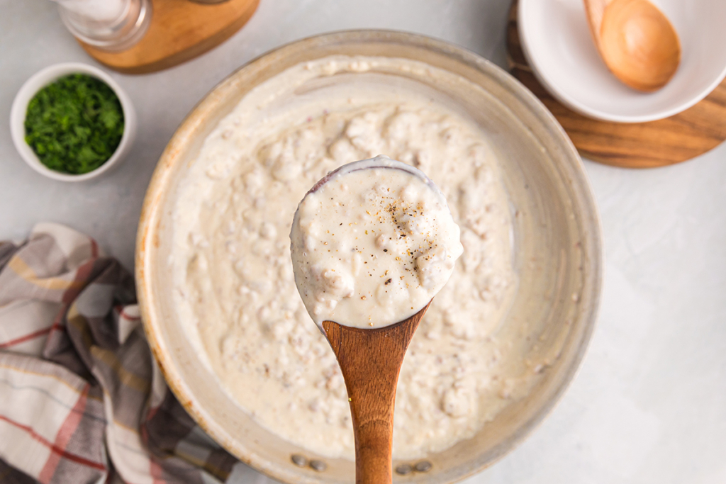 overhead shot of spoon over pan of country gravy