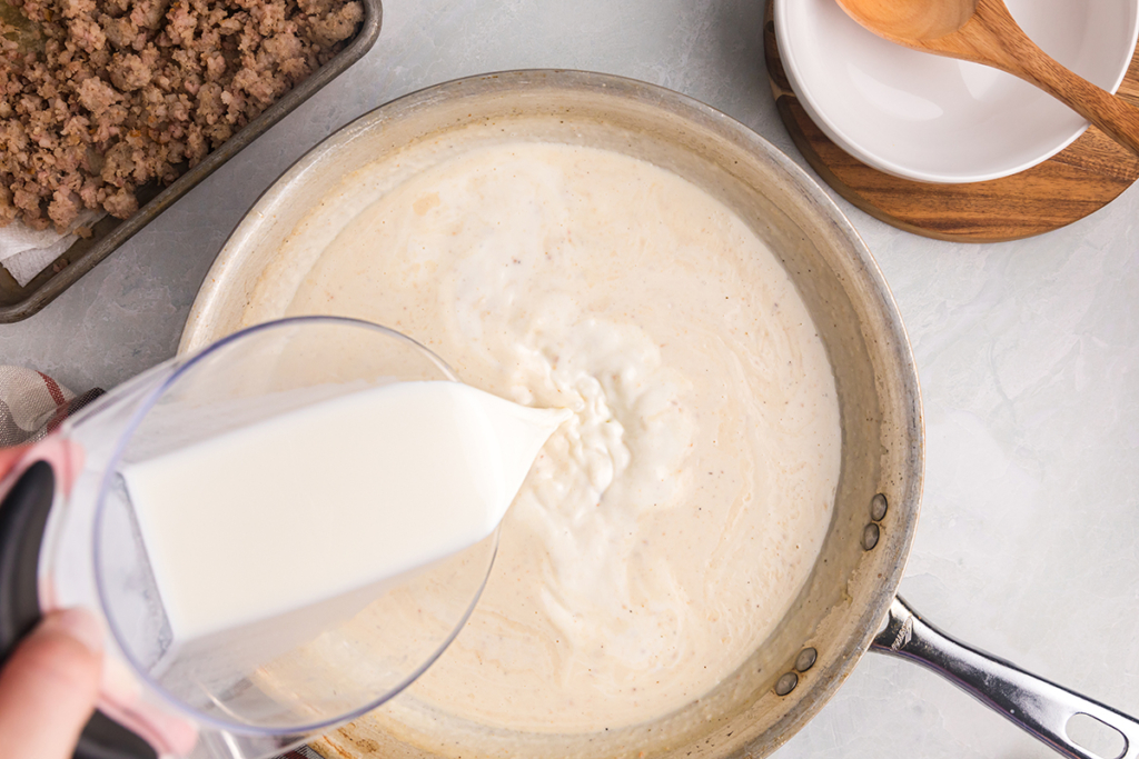 milk poured into pan of roux