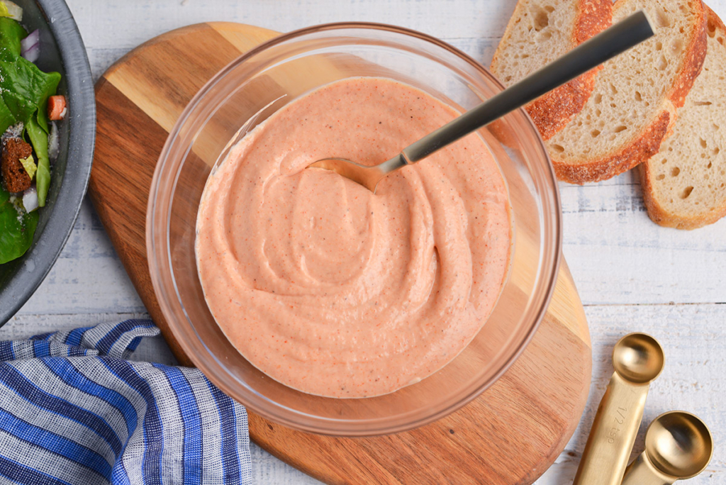 overhead shot of russian dressing in bowl with spoon