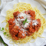 overhead shot of spaghetti sauce over pasta