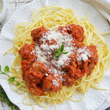 overhead shot of spaghetti sauce over pasta