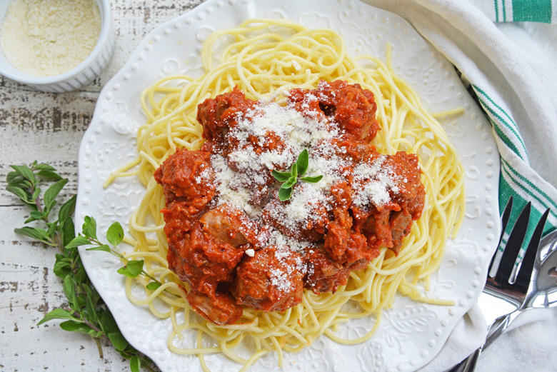 overhead shot of spaghetti sauce over pasta