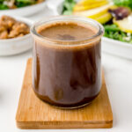 angled shot of jar of honey balsamic vinaigrette