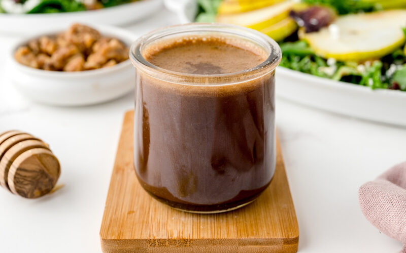 angled shot of jar of honey balsamic vinaigrette