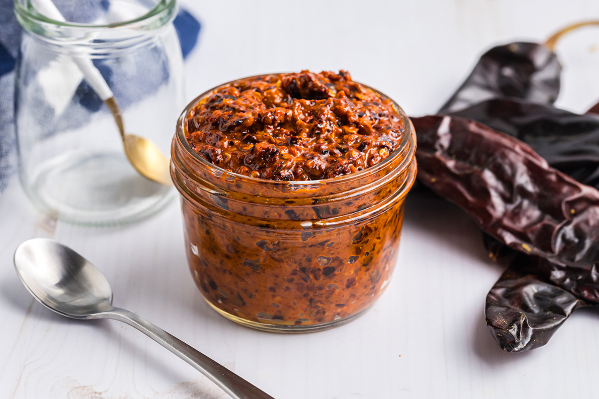 angled shot of jar of harissa sauce