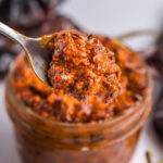 close up shot of harissa sauce on spoon